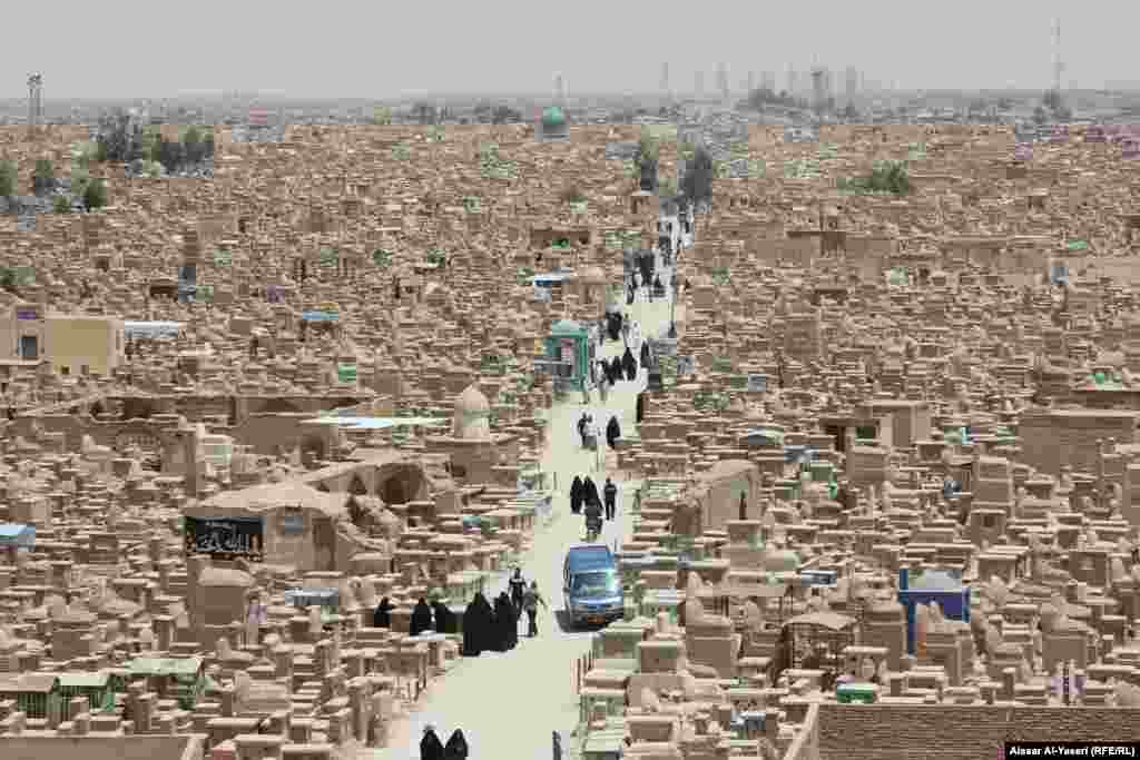Pilgrims in the Wadi al-Salam cemetery in Najaf, Iraq, on the holy day commemorating the Night Journey of the Prophet Muhammad. Najaf, which lies some 170 kilometers south of Baghdad, is the location of a shrine to a revered figure in Shi'ite Islam. (RFE/RL/Aissar Al-Yaseri)