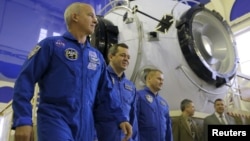 NASA astronaut Jeff Williams (left to right) and Russian cosmonauts Oleg Skripochka and Aleksei Ovchinin attend a training examination at the Gagarin cosmonaut training center outside Moscow in February.