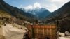 Elaborately decorated trucks rumble over even the most isolated roads of Pakistan. This &quot;jingle truck&quot; is headed down the Karakoram highway.