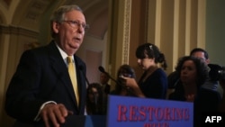 U.S. Senate Majority Leader Mitch McConnell speaks to members of the media during a news briefing in Washington in July.