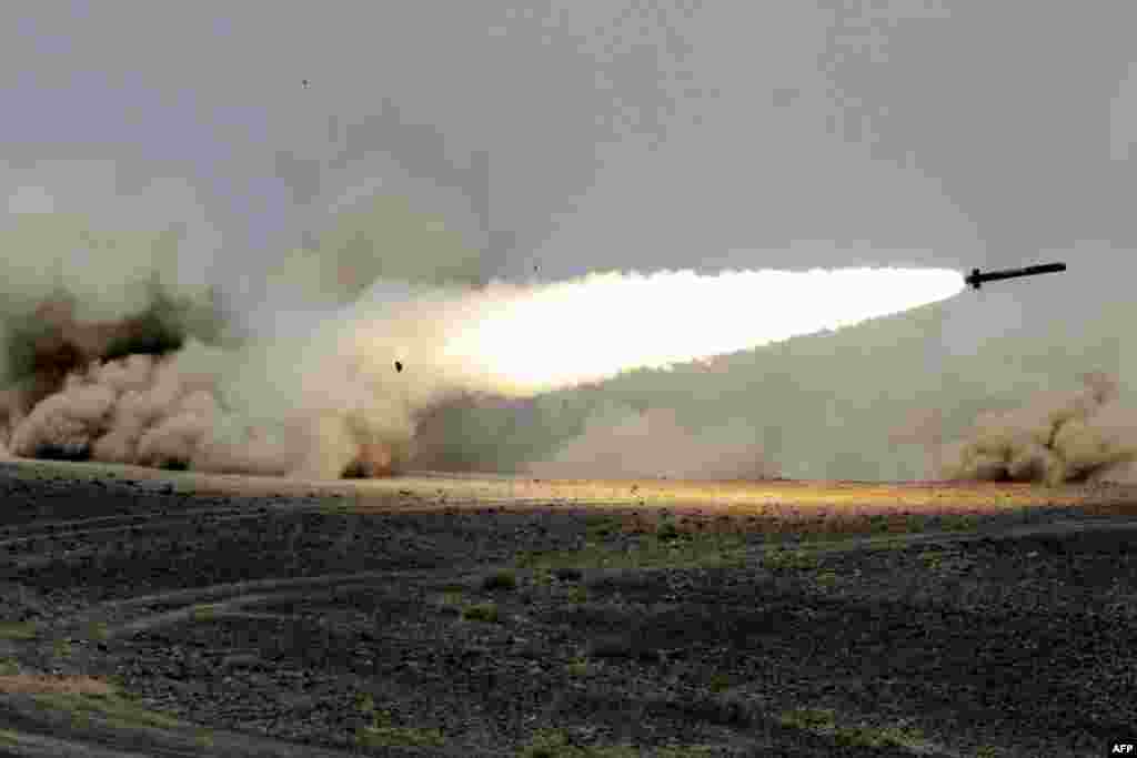 A rocket is fired during joint Jordanian-U.S. maneuvers in Mudawwara, near the border with Saudi Arabia. (AFP/Khalil Mazraawi)