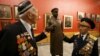 World War II veterans touch an exhibit showing Soviet leader Josef Stalin at the Central Museum of the Great Patriotic War in Moscow. (file photo)