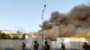 Smoke rises from the Governorate Council building of Basra, Iraq September 6, 2018