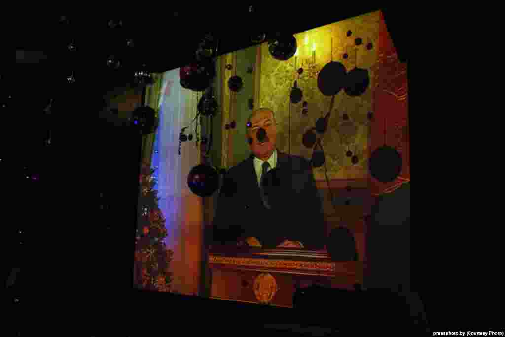 Christmas decorations are silhouetted on a TV screen in a Minsk nightclub during President Alyaksandr Lukashenka&#39;s New Year&#39;s address to the nation. Photo by Dzmitry Klyapitski