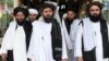 ملابرادر رئیس دفتر سیاسی گروه طالبان در قطر (وسط) که شامل فهرست تحریم پاکستان شده است.