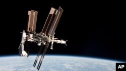 The International Space Station and the docked space shuttle "Endeavour" in May 2011
