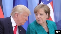 German Chancellor Angela Merkel (right) and U.S. President Donald Trump speak during a panel discussion at the G20 summit in Hamburg last week.