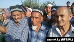 Uzbek men at the newly reopened Dostyk border crossing earlier this month. The effort to simplify crossing procedures affects hundreds of thousands of people with relatives on both sides of the border.