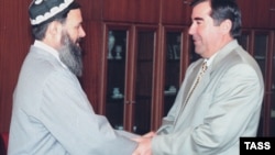 Tajik President Emomali Rahmon (right) meets with Said Abdullo Nuri, the leader of the United Tajik Opposition, in Dushanbe in December 1997.