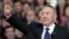 Kazakhstan - FILE PHOTO: Kazakhstan's President and presidential candidate Nursultan Nazarbayev waves to audience during an election campaign rally at a stadium in Almaty, Kazakhstan April 18, 2015. REUTERS/Shamil Zhumatov/File Photo