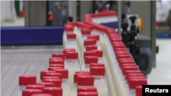  Various of Dairy Bottles Moving on Conveyor Belt At Basra Factory