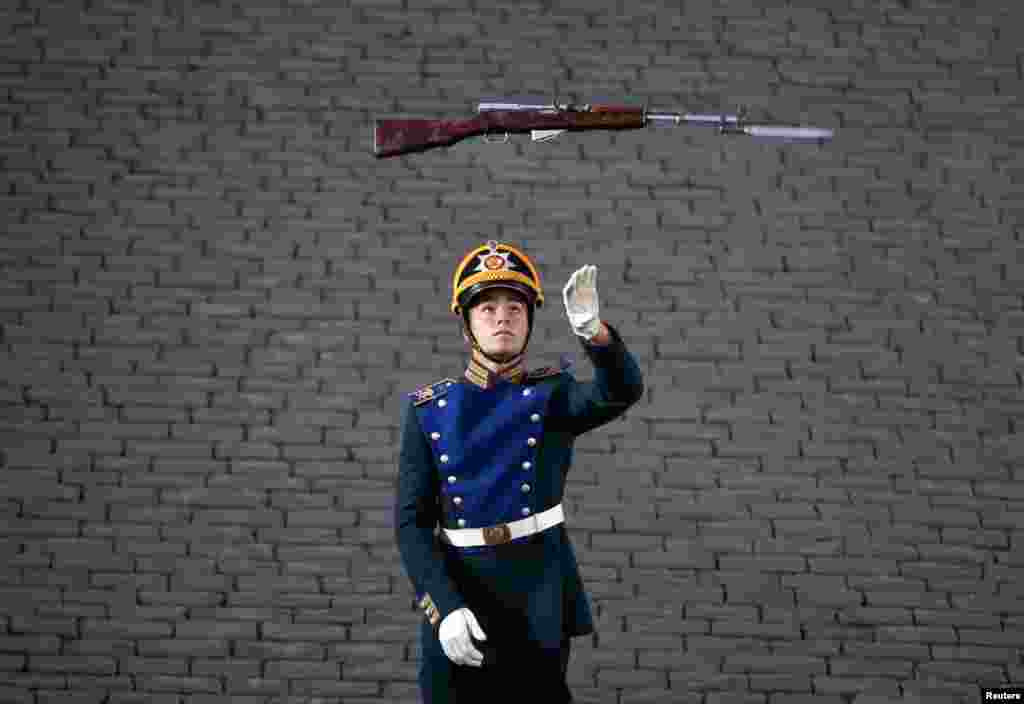A member of the Guard of Honor of the Presidential Regiment from Russia performs on the final day of the International Military Music Festival on Red Square in Moscow. (Reuters/Maksim Zmeyev)