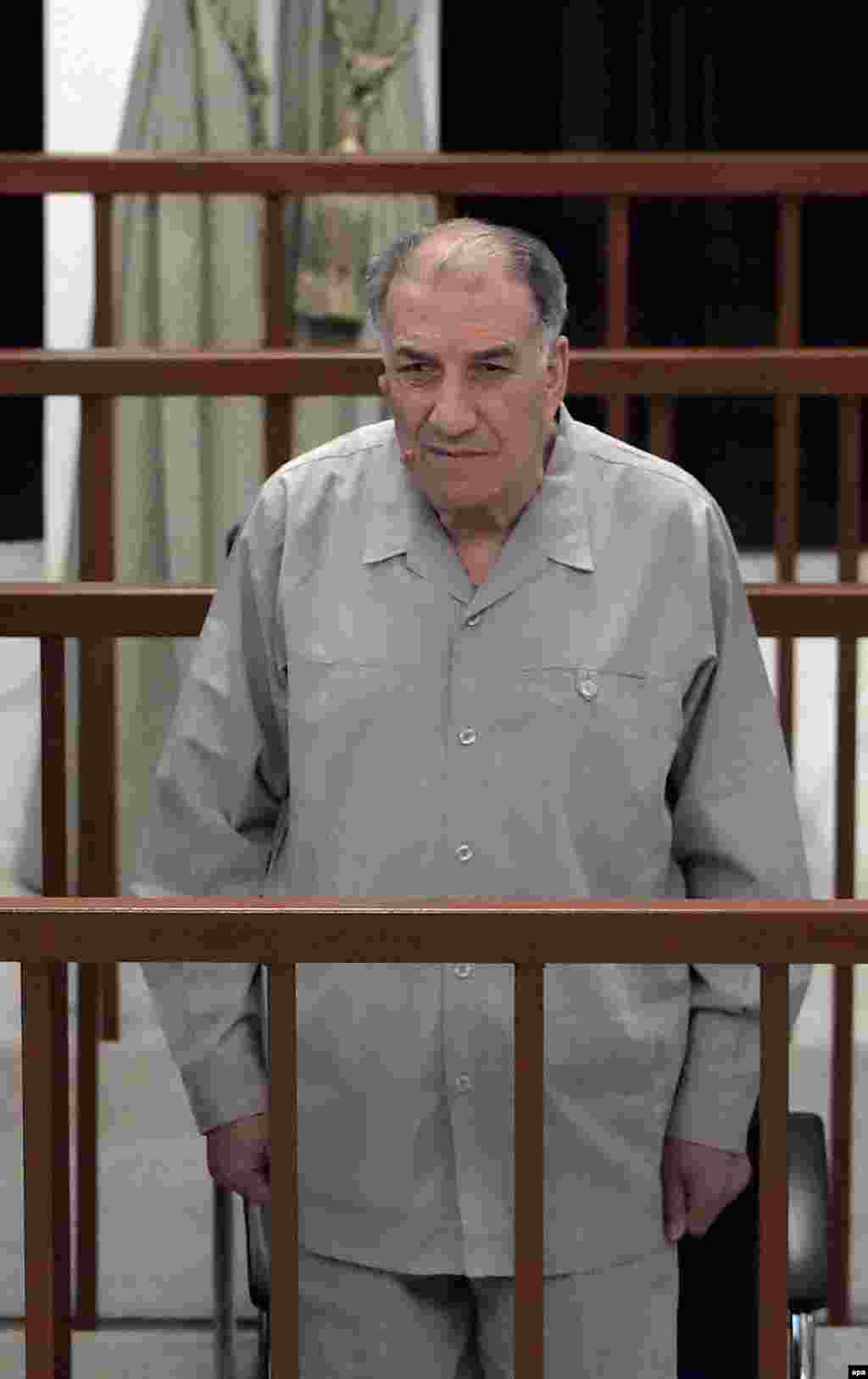 Ali Dayah Ali listens as the verdict against him is read (epa) - Ali Dayah Ali, a former local Ba'ath Party official, was sentenced to 15 years' imprisonment.
