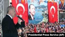 Turkish President Recep Tayyip Erdogan addresses the supporters of his ruling Justice and Development Party during a rally in Eregli, March 19, 2019