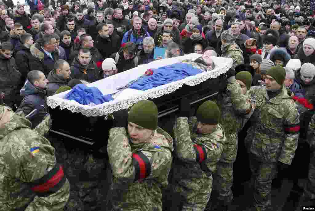 In Ukraine, Soldiers' Funerals, Food Distribution Amid New Outburst Of ...