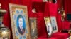 Portraits of former President Viktor Yanukovych greet visitors to the museum exhibit.