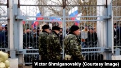 On the blocked territory of the military unit, servicemen lined up in the form of a trident