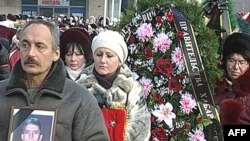 A funeral ceremony for some of the 20 who died on board the "Nerpa"