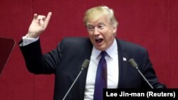 U.S. President Donald Trump delivers a speech at the National Assembly in Seoul on November 8.