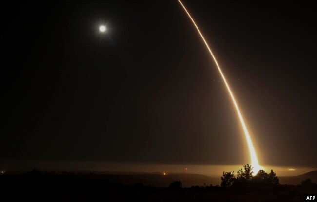Nuclear Weapons Inspections - A streak of light trails off into the night sky after the U.S. military test-fired an unarmed intercontinental ballistic missile at Vandenberg Air Force Base, some 200 kilometers northwest of Los Angeles, in May 2017.
