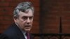 Former British Prime Minister Gordon Brown arrives to give evidence before the Leveson Inquiry at the High Court in London.