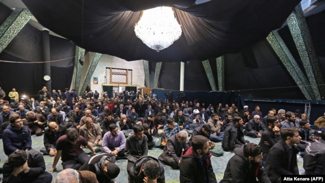 Iranian students attend a memorial for the victims of the Ukraine plane crash at the University of Tehran in January.