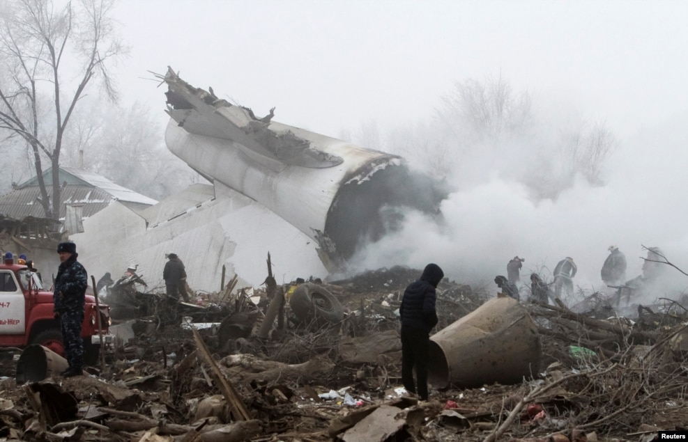 Rescue teams are seen at the crash site of a Turkish cargo jet near Manas airport outside Bishkek, Kyrgyzstan, on January 16. More than 30 people died in the incident.&nbsp;(Reuters/Vladimir Pirogov)