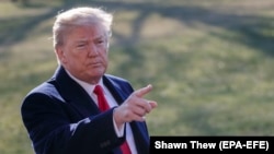 U.S. President Donald Trump speaks to the media on March 13 outside the White House.