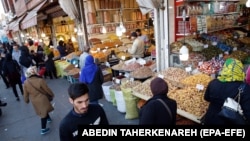 Iranians shop in Molavi old bazaar in Tehran, Iran, March 4, 2019.
