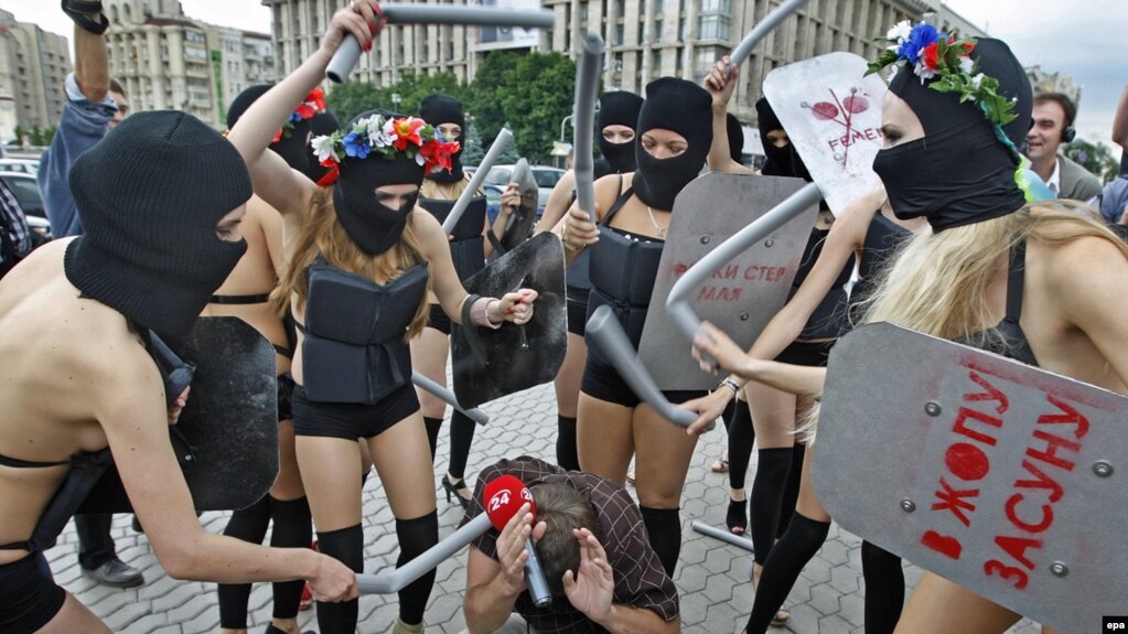 Members Of The Activist Group FEMEN Dressed In Scanty Riot Police Outfits Members Of The Activist Group FEMEN Dressed In Scanty Riot Police Outfits