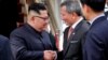 North Korean leader Kim Jong Un (left) is welcomed by Singapore's Foreign Minister Vivian Balakrishnan (center) upon his arrival on June 10.