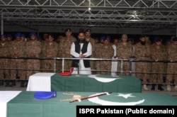 FILE: Pakistani soldiers and officer offer funeral prayers for colleagues killed in North Waziristan.