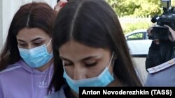 Krestina and Angelina Khachaturyan (right) arrive for a hearing at the Moscow City Court. (file photo)