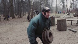 Working Out With Manhole Covers In Moscow's Woods