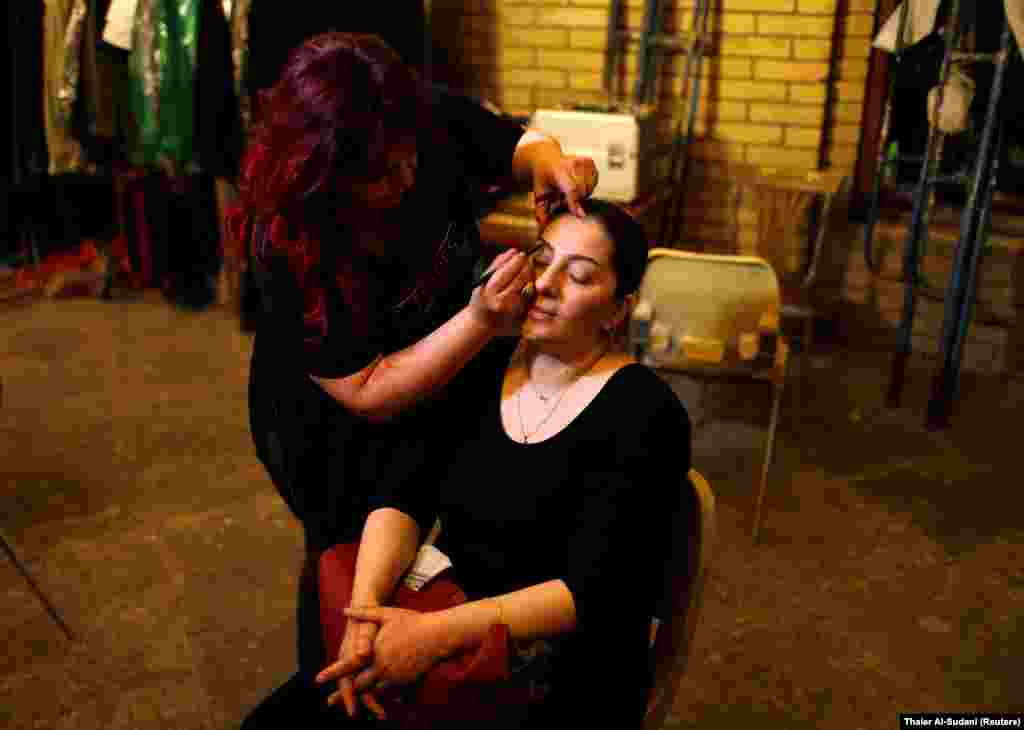 IRAQ - An Iraqi actor has her makeup applied before performing in the hotel, a TV series which is being filmed and broadcast during the Muslim holy month of Ramadan, in Baghdad, Iraq May 12, 2019