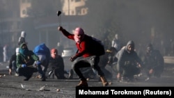 Трамптын Иерусалим боюнча чечимине каршы чыккан палестиналык демонстранттар.