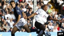 Goran Bunjevcevic (left) in action for Tottenham Hotspur against Fulham's Collins John in 2004. 