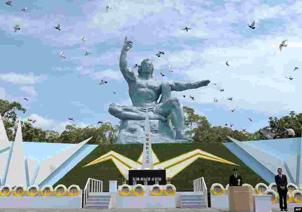 Doves fly around the monument during a memorial ceremony to mark the 71st anniversary of the atomic bombing at the Peace Memorial Park in Nagasaki, Japan, on August 9. (AFP/Jiji Press)