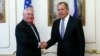 U.S. Secretary of State Rex Tillerson (left) and Russian Foreign Minister Sergei Lavrov meet on the sidelines of an annual session of the OSCE Council of Foreign Ministers in Vienna on December 7.