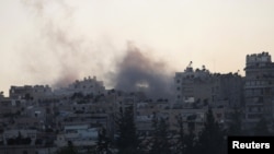 Syria -- Smoke rises from Aleppo's Saif al-Dawla district, 21Aug2012