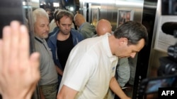 The first team of OSCE observers arrive at a hotel in Donetsk after being freed on June 27.