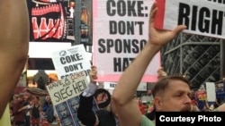 Gay-rights protesters in New York's Times Square call on Coca-Cola to drop its sponsorship ahead of the Winter Olympics in Sochi. (photo courtesy of RUSA LGBT)