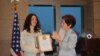 Armenia -- Young activist Mariam Sukhudian (L) is awarded by U.S. Ambassador Marie L. Yovanovitch , Yerevan, 10Mar2010
