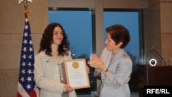 Armenia -- Young activist Mariam Sukhudian (L) is awarded by U.S. Ambassador Marie L. Yovanovitch , Yerevan, 10Mar2010