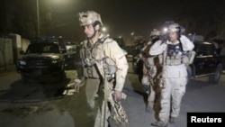 Members of Afghan Crisis Response Unit (CRU) arrive at the site of a Taliban attack in the capital Kabul on December 11.