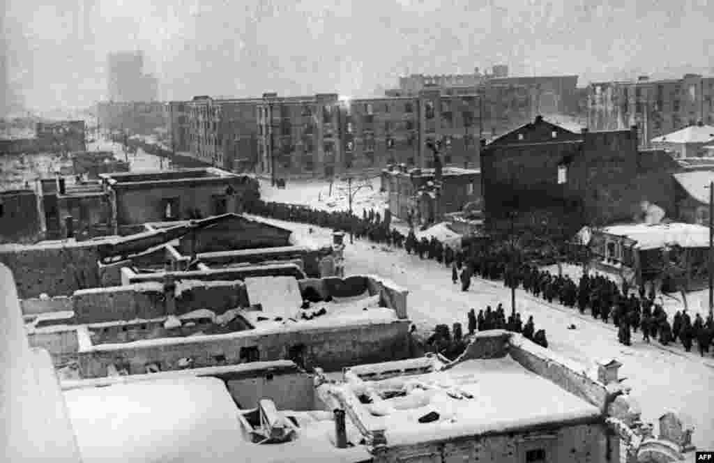 Columns of Nazi German Wehrmacht soldiers pass through the streets of Stalingrad on February 1, 1943.