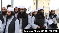 Newly freed Taliban prisoners are processed at Bagram prison, north of Kabul, on April 9.