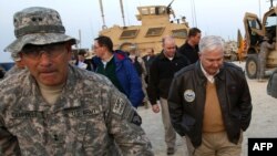 General John Campbell (left) with then U.S. Secretary of Defense Robert Gates (right) in Kunar Province in 2010. (file photo)