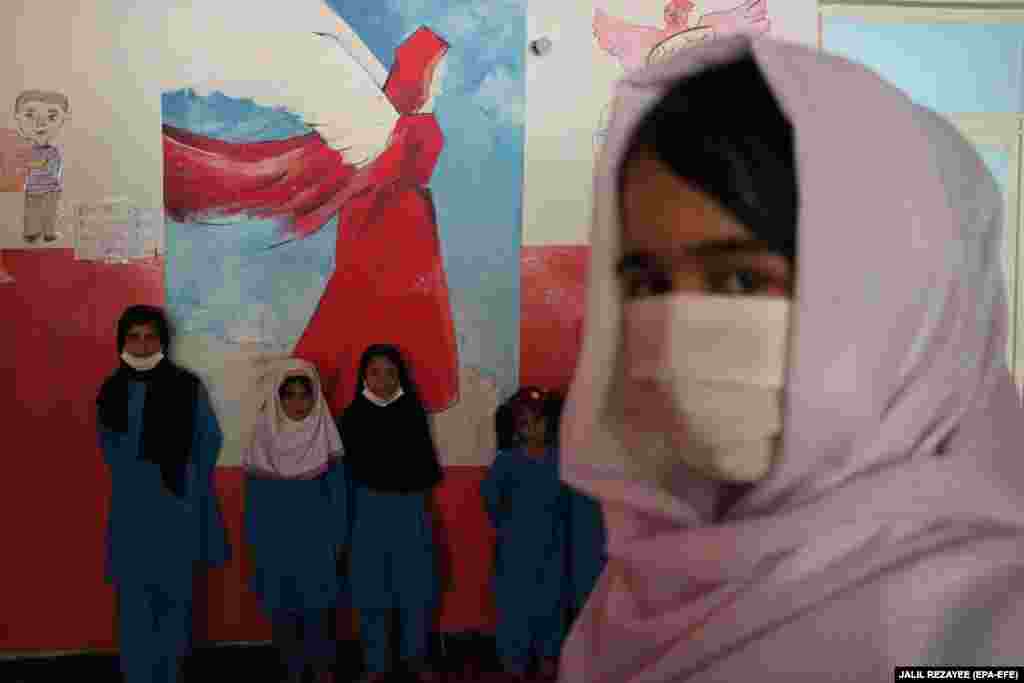 Afghan orphans visit an orphanage's library in Herat. NATO's Resolute Support Mission helped the orphanage renovate the library and provided several books. (epa-EFE/Jalil Rezayee)