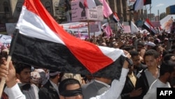 Yemeni antigovernment protesters shout slogans during a "day of rage" protest in Sanaa.